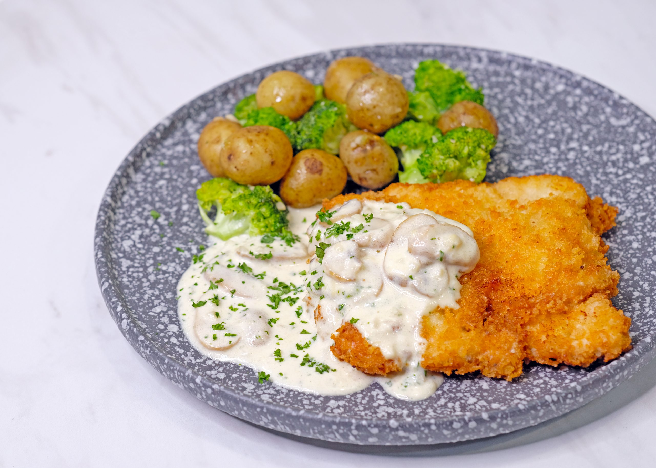 Chicken Schnitzel with Creamy Mushroom Sauce and Sautéed Vegetables